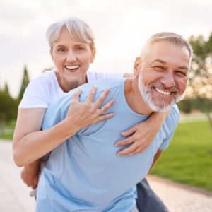 older couple piggy back no painride